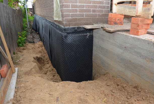 Happy homeowners after waterproofing job in Elmhurst